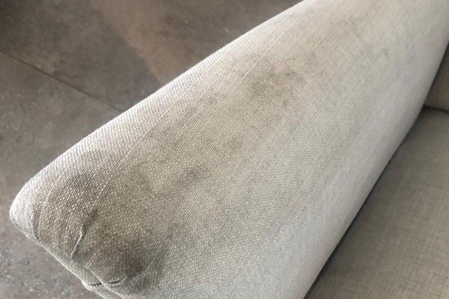 Heavily soiled sofa before deep cleaning in Silvassa by Steam Car Spa